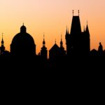 Silhouette of the old town buildings seen from Charles Bridge at sunrise, UNESCO World Heritage Site, Prague, Bohemia, Czech Republic